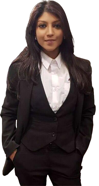 Roshni Gopaul is wearing a black suit and smiling at the camera